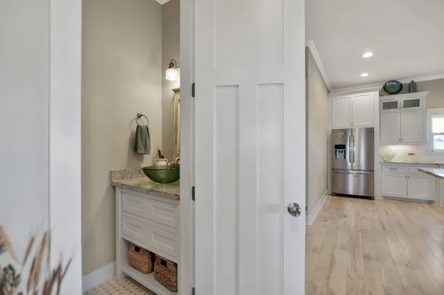 a kitchen with stainless steel appliances granite countertop a refrigerator and a sink