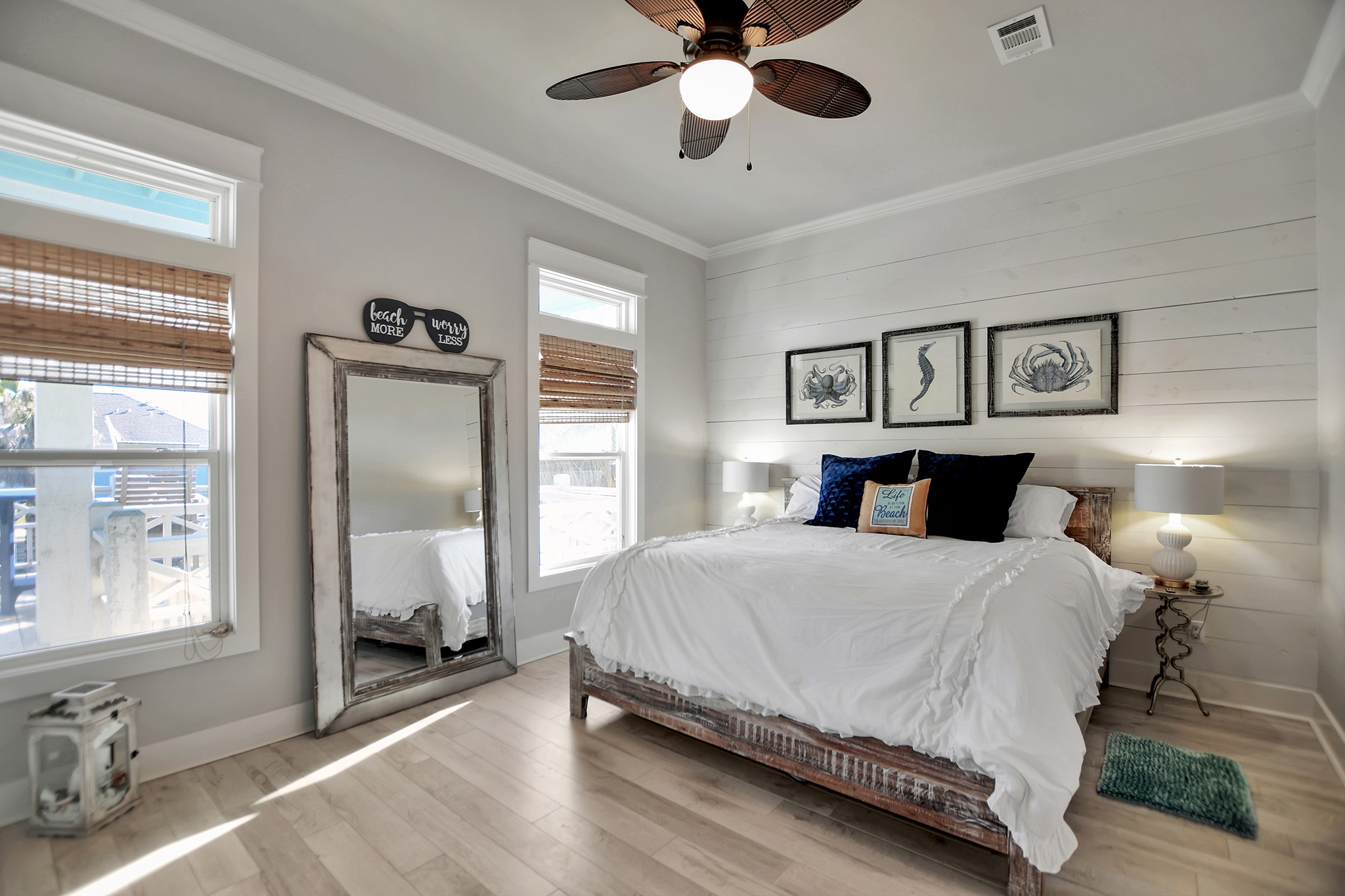 2570 Tide Road Port Bolivar, TX 77650 - Photo 32 of 50 a bedroom with a large bed and a chandelier