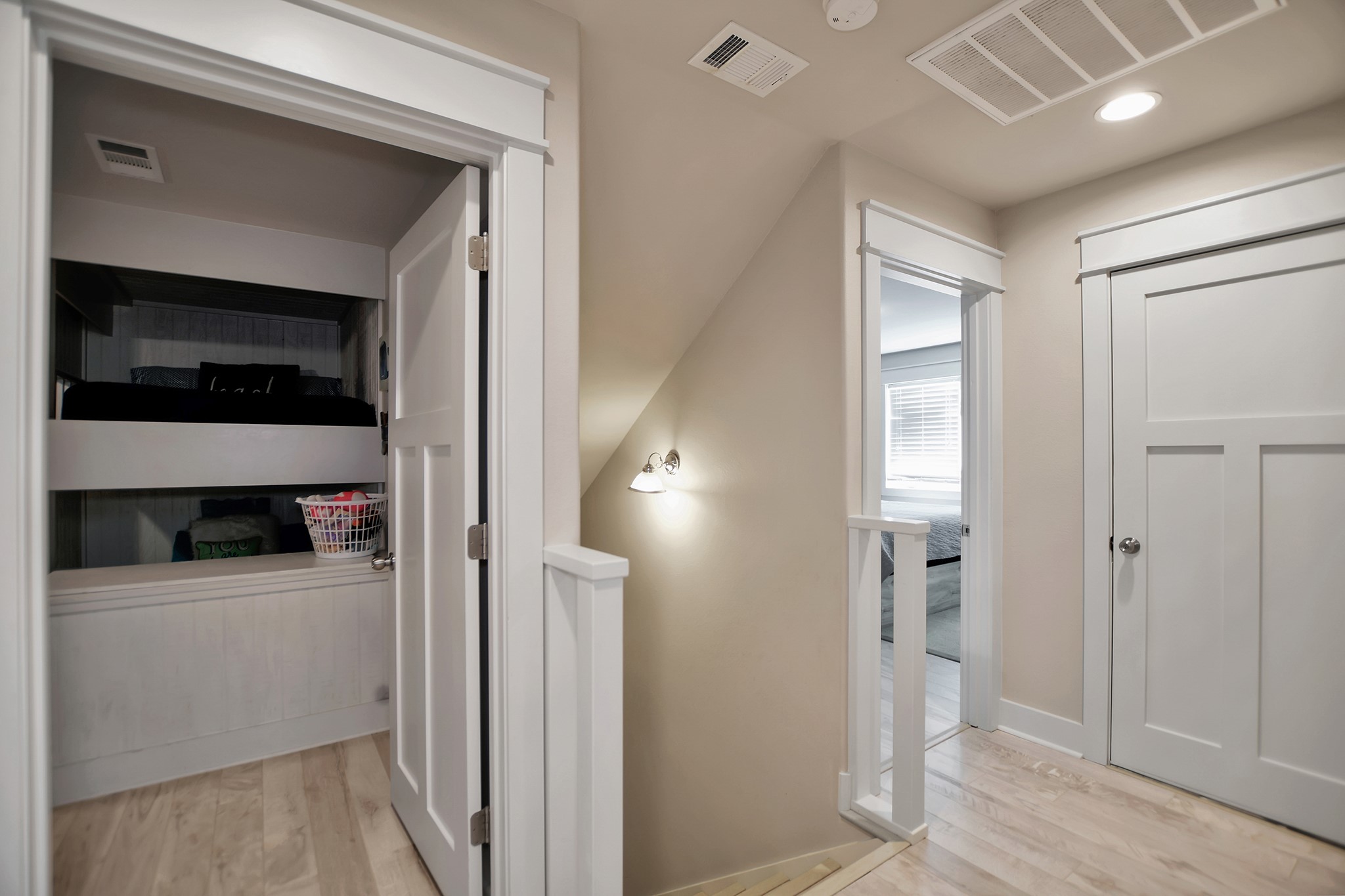 2570 Tide Road Port Bolivar, TX 77650 - Photo 38 of 50 a view of a hallway and an empty room with wooden floor