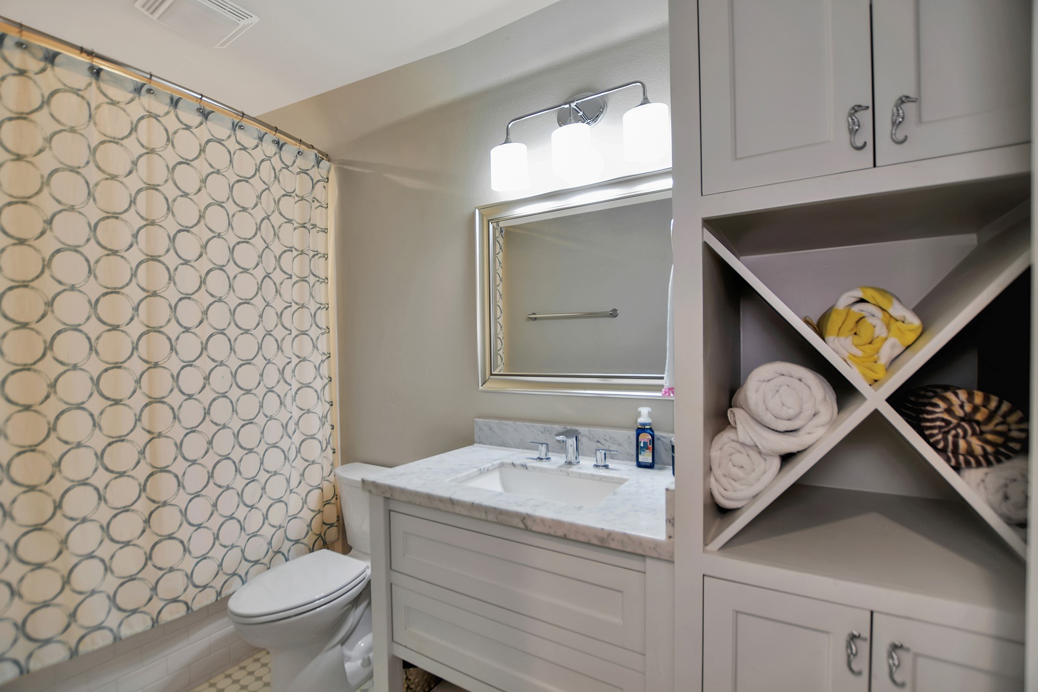 2570 Tide Road Port Bolivar, TX 77650 - Photo 41 of 50 a bathroom with a sink a toilet and a shower curtain