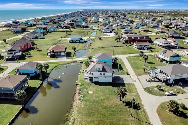 an aerial view of a house with a swimming pool