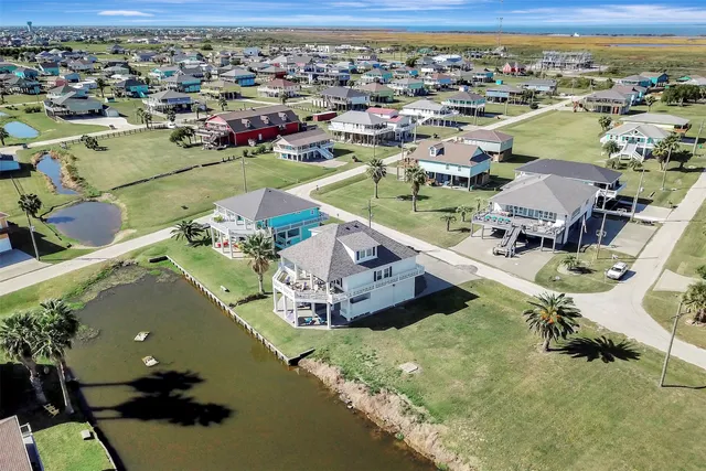 an aerial view of a house with a swimming pool