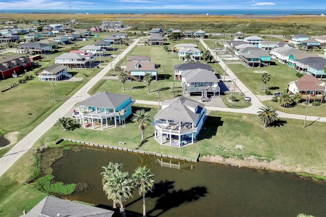 an aerial view of a house with a ocean view