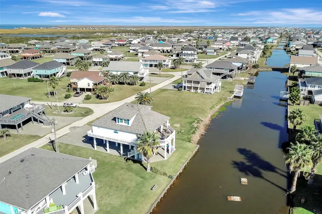 an aerial view of residential houses with outdoor space