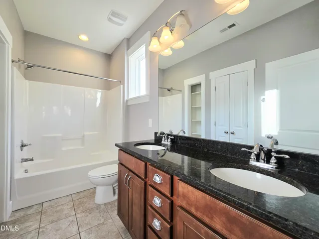 a living room with furniture gym equipment and a large window