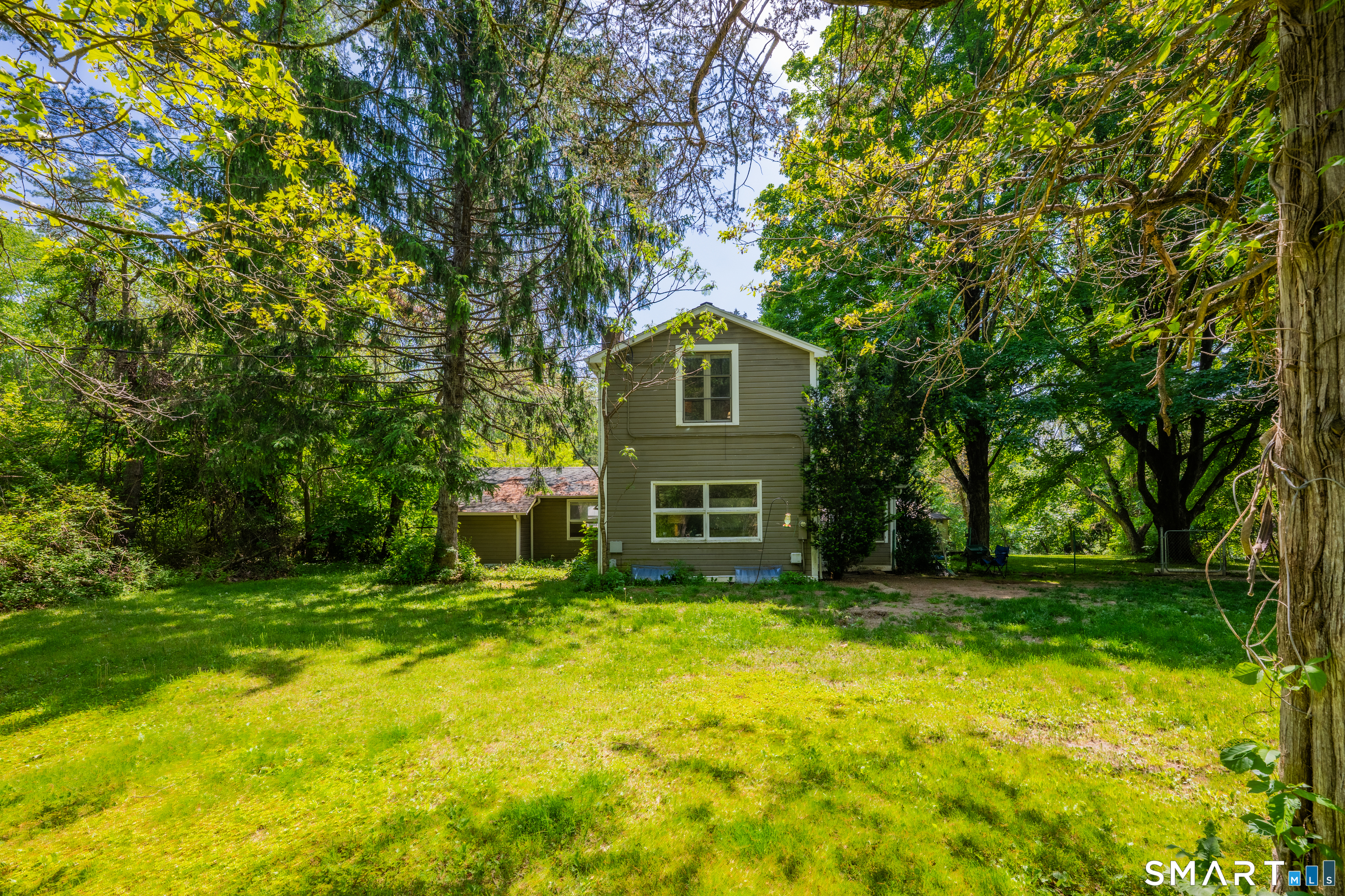 231 B Kent Road Kent, CT 06757 - Photo 24 of 35 a front view of a house with a yard