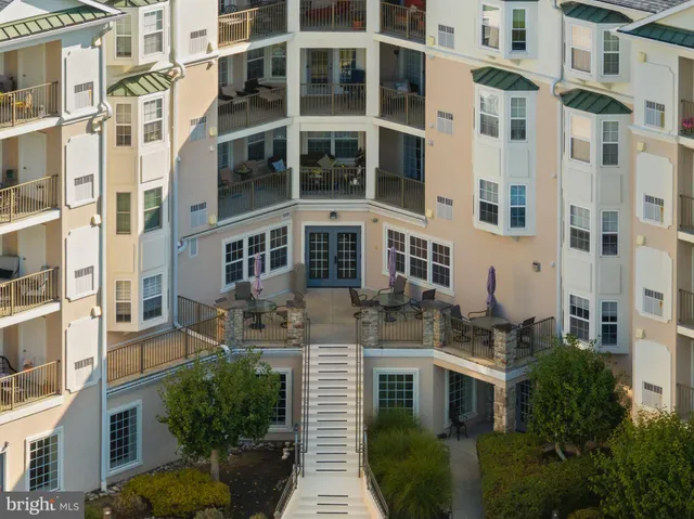 a view of backyard with a table and chairs