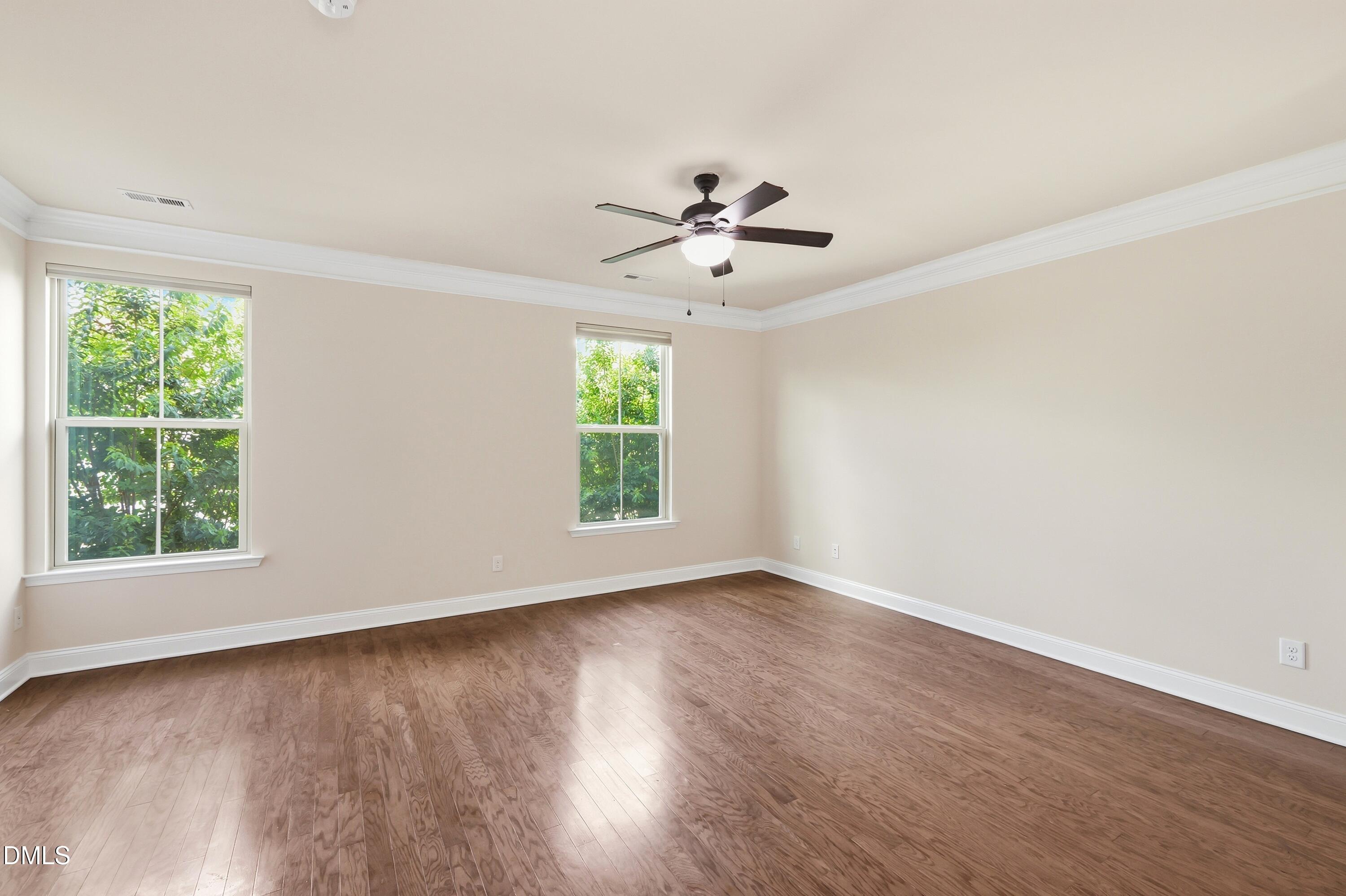 1004 Waymaker Court Apex, NC 27502 - Photo 5 of 30 wooden floor in an empty room with a window