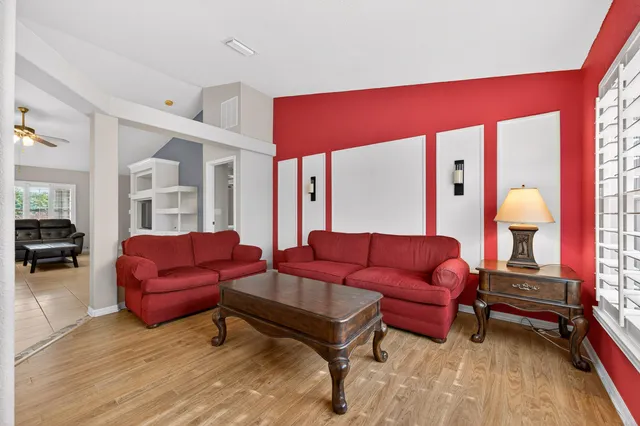 a bathroom with a double vanity sink a mirror and a bathtub