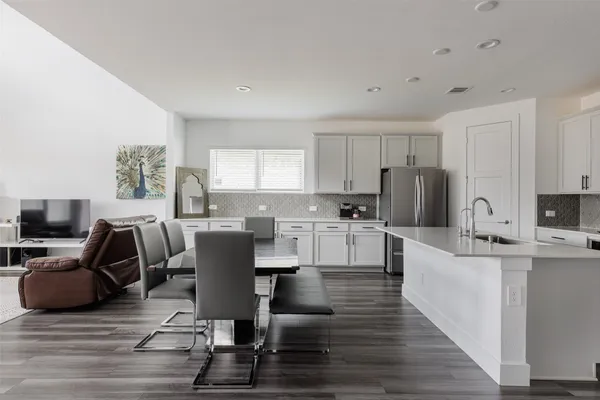 a view of kitchen with cabinets and stainless steel appliances