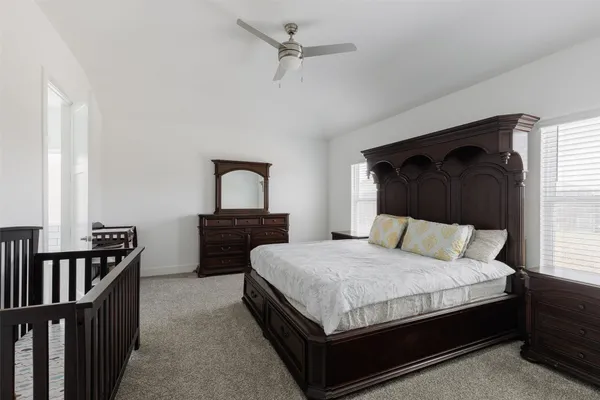a bedroom with a bed and a table