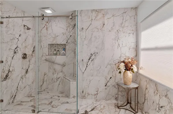 a vase of flowers sitting on a table