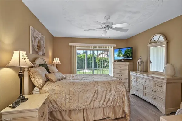 a bed room with a bed and a television