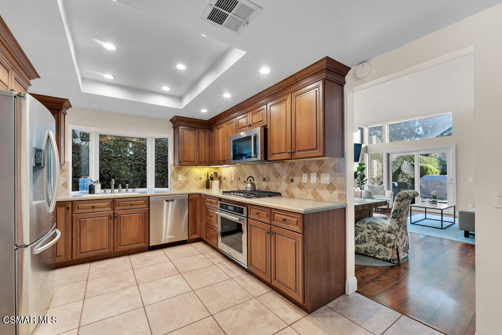 16 Valley Crest Road Simi Valley, CA 93065 - Photo 13 of 41 a kitchen with a stove sink and cabinets