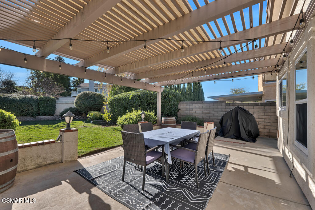 16 Valley Crest Road Simi Valley, CA 93065 - Photo 32 of 41 a view of a patio with a table and chairs