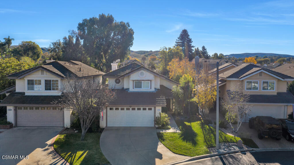 16 Valley Crest Road Simi Valley, CA 93065 - Photo 37 of 41 a view of a house with a small yard and a large tree in it