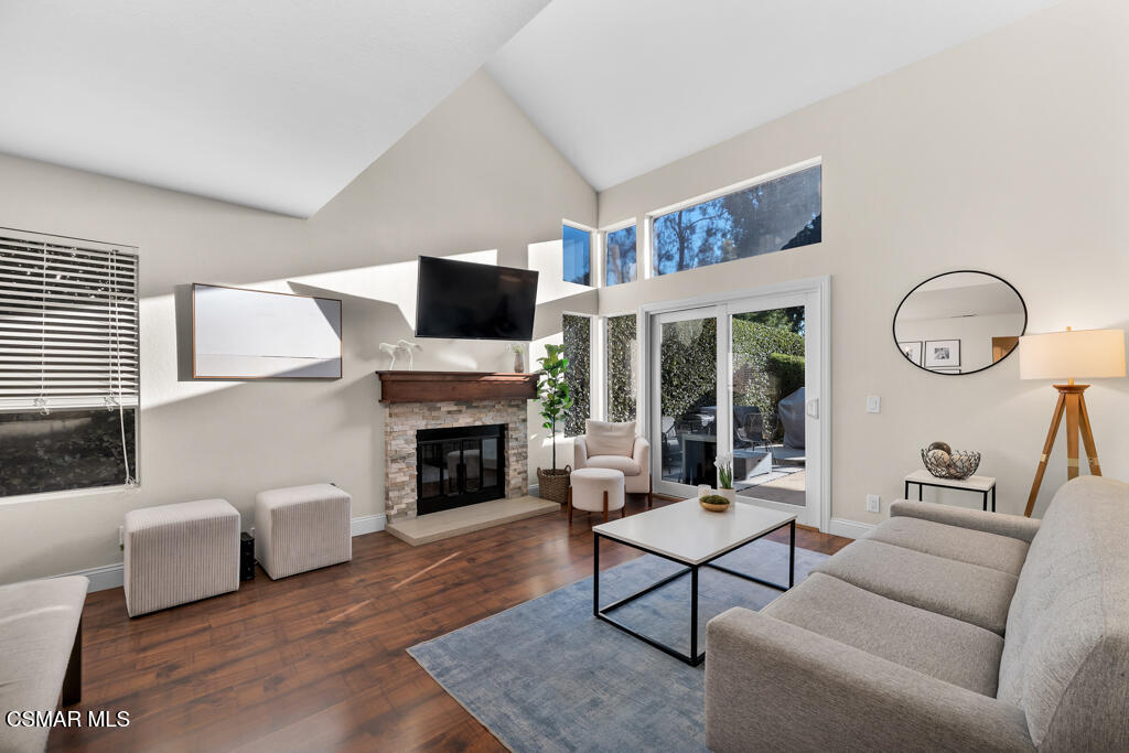 16 Valley Crest Road Simi Valley, CA 93065 - Photo 9 of 41 a living room with furniture a fireplace and a flat screen tv