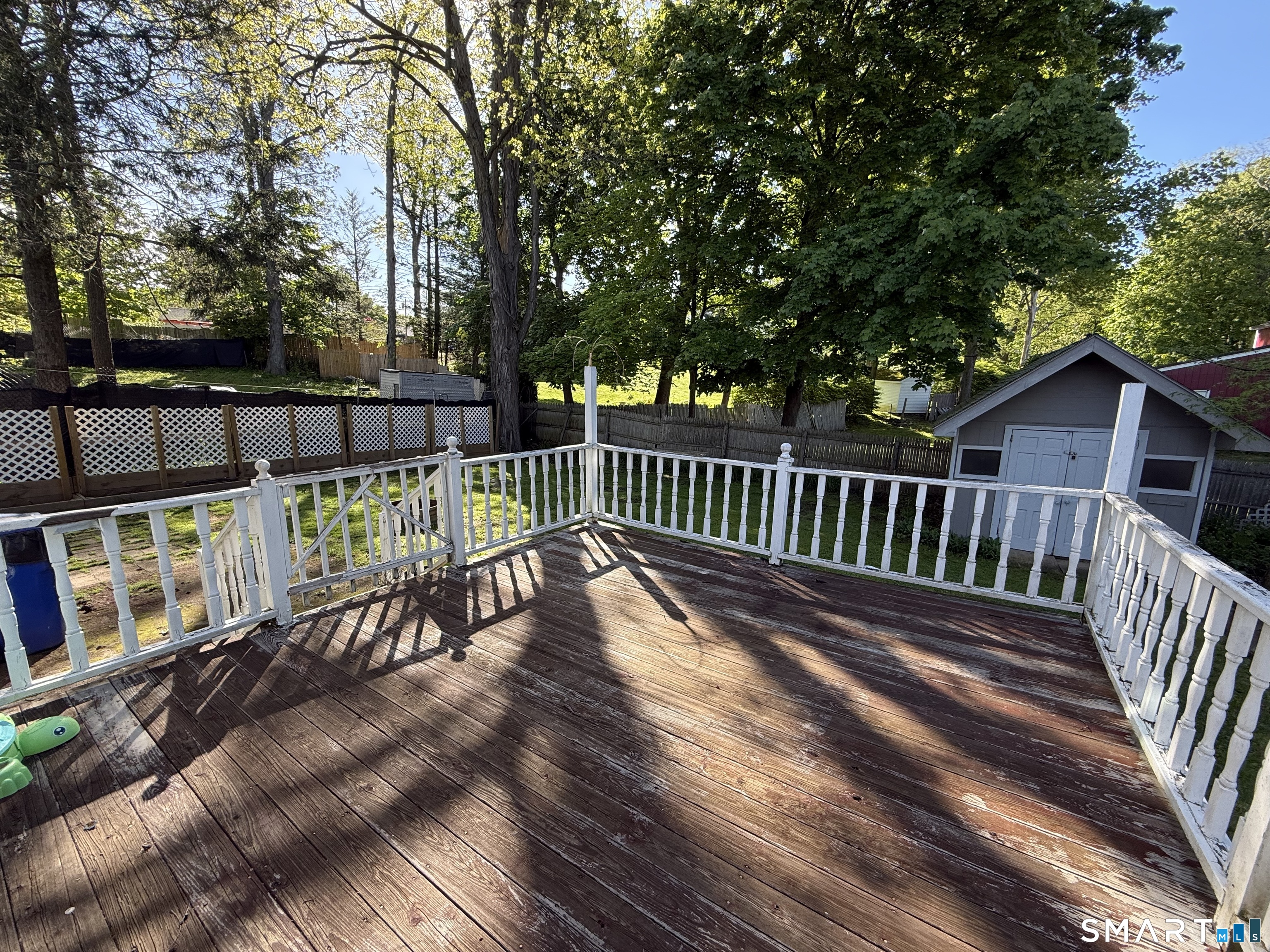 808 East Main Street Torrington, CT 06790 - Photo 9 of 40 a view of a wooden deck with a bench
