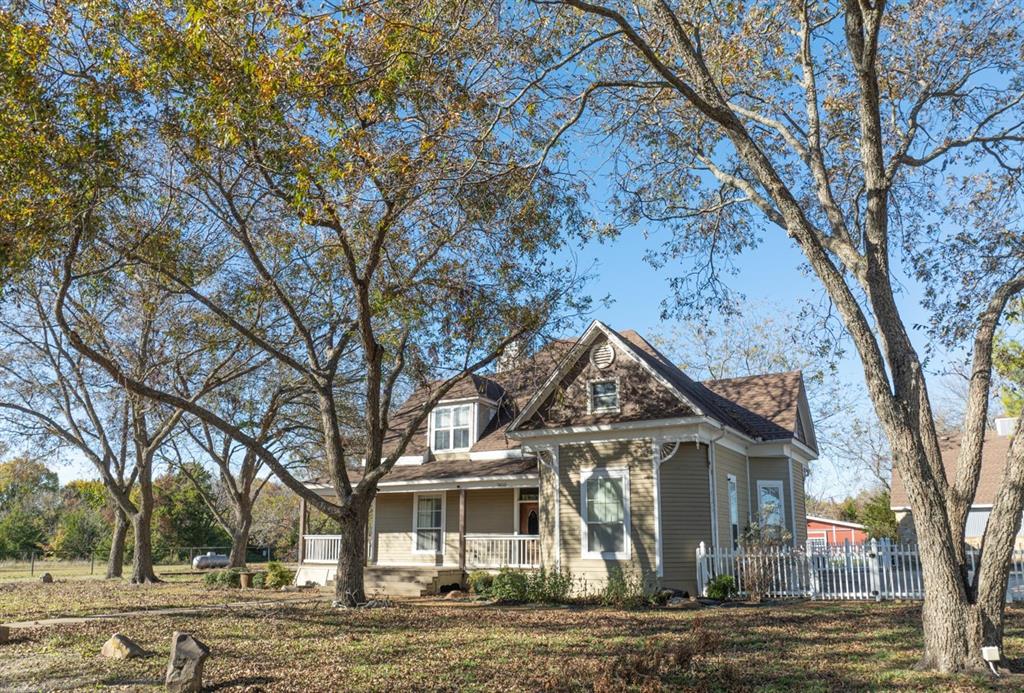 7450 Fm 982 Princeton, TX 75407 - Photo 8 of 13 a view of a house with a yard