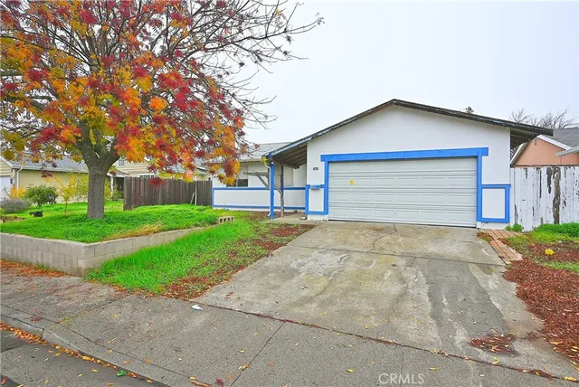 a front view of house with yard and green space