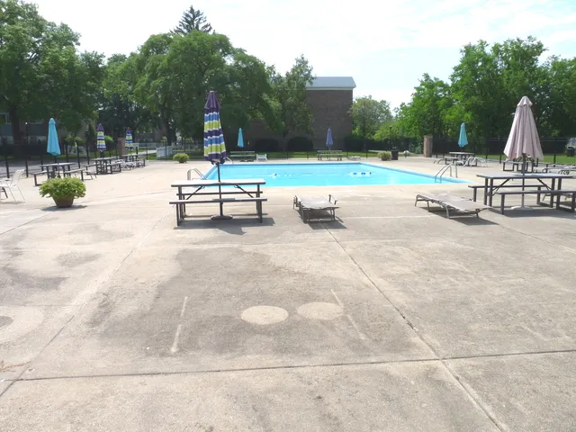 a childrens park with lots of swings and slides