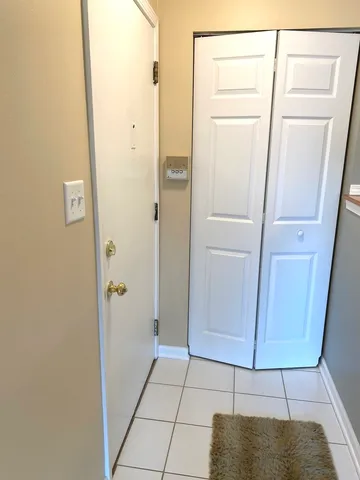 a bathroom with a shower and a mirror