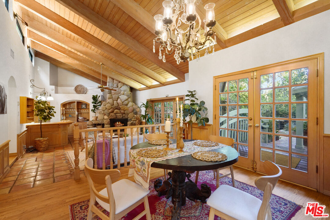 964 Old Topanga Canyon Road Topanga, CA 90290 - Photo 1 of 75 a view of a dining room with furniture wooden floor and chandelier