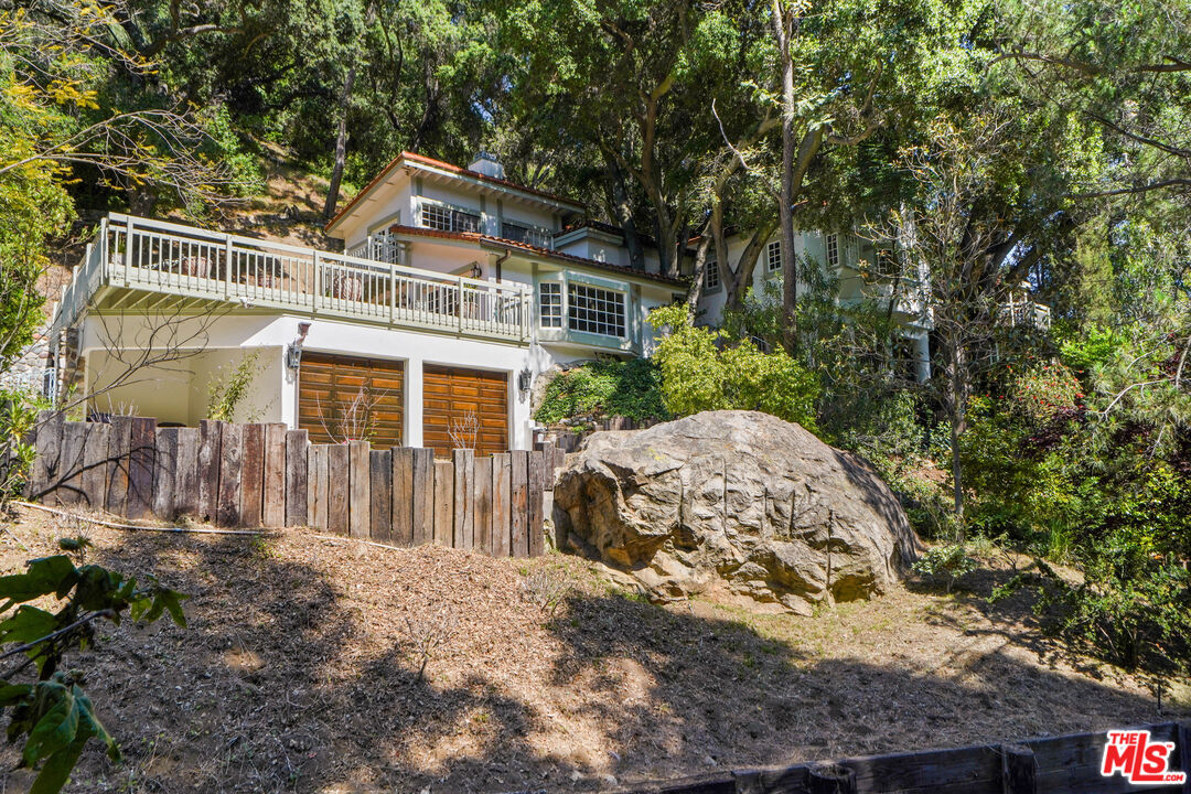 964 Old Topanga Canyon Road Topanga, CA 90290 - Photo 11 of 75 a front view of a house with a yard