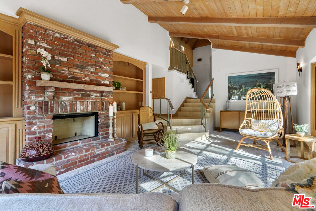 964 Old Topanga Canyon Road Topanga, CA 90290 - Photo 13 of 75 a living room with couches and a fireplace