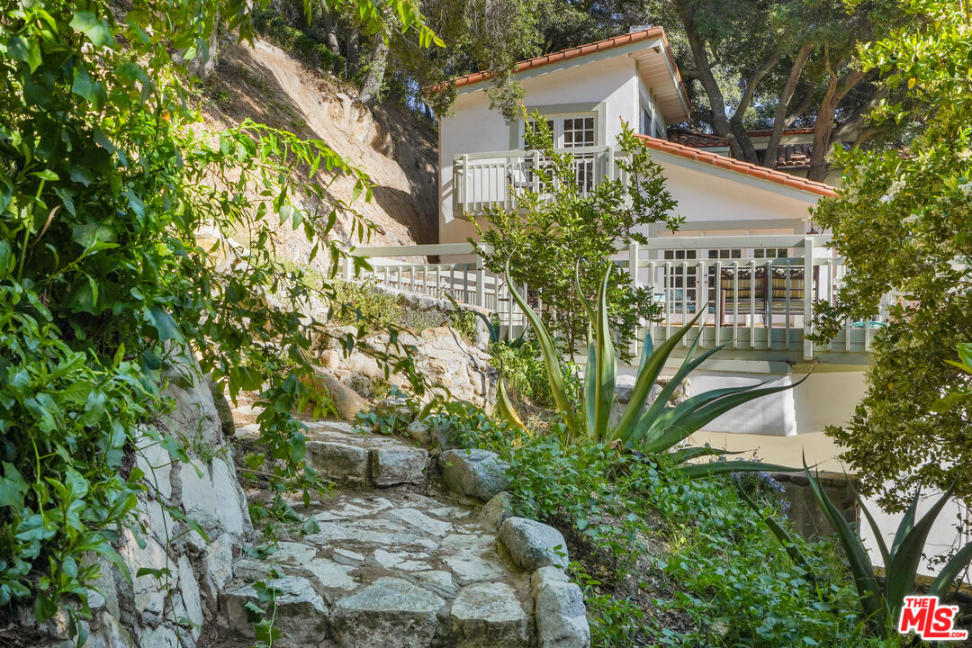 964 Old Topanga Canyon Road Topanga, CA 90290 - Photo 17 of 75 a view of a house with a yard and plants