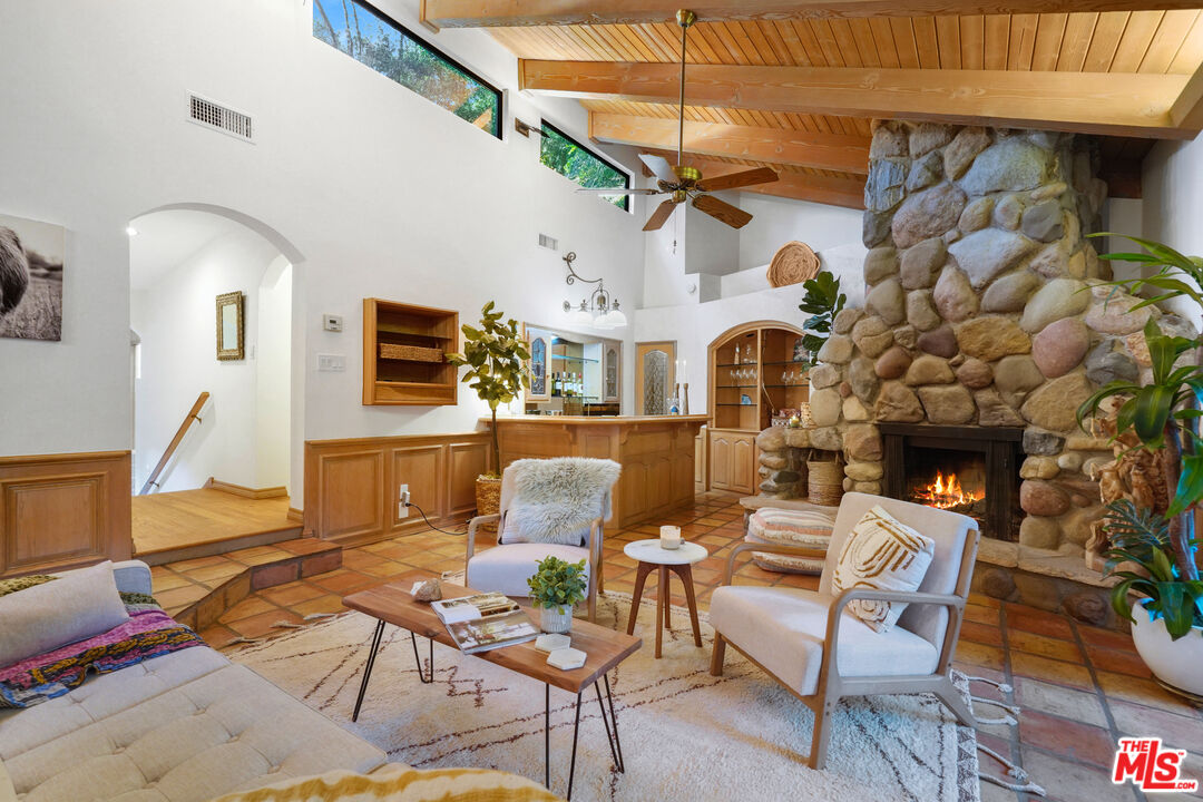 964 Old Topanga Canyon Road Topanga, CA 90290 - Photo 19 of 75 a living room with patio furniture and a fireplace