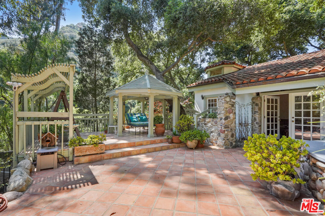 964 Old Topanga Canyon Road Topanga, CA 90290 - Photo 2 of 75 a front view of a house with garden