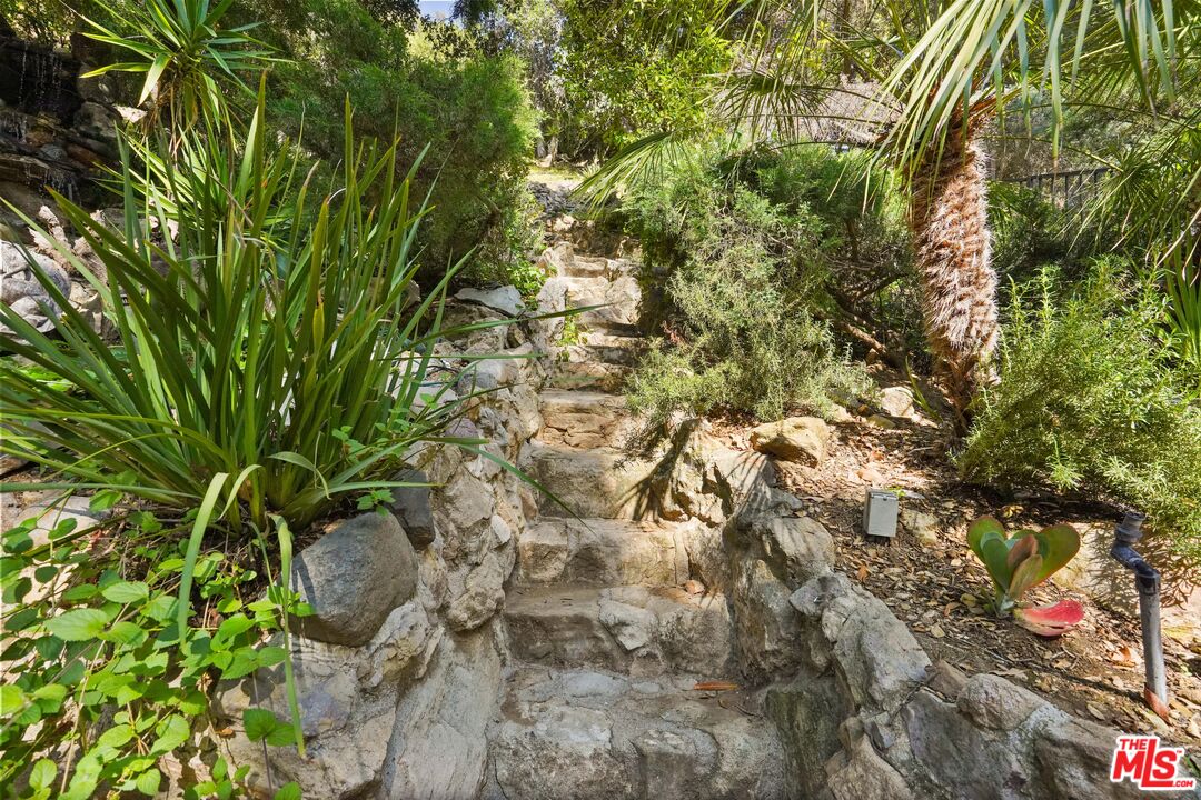 964 Old Topanga Canyon Road Topanga, CA 90290 - Photo 32 of 75 a backyard of a house with lots of trees