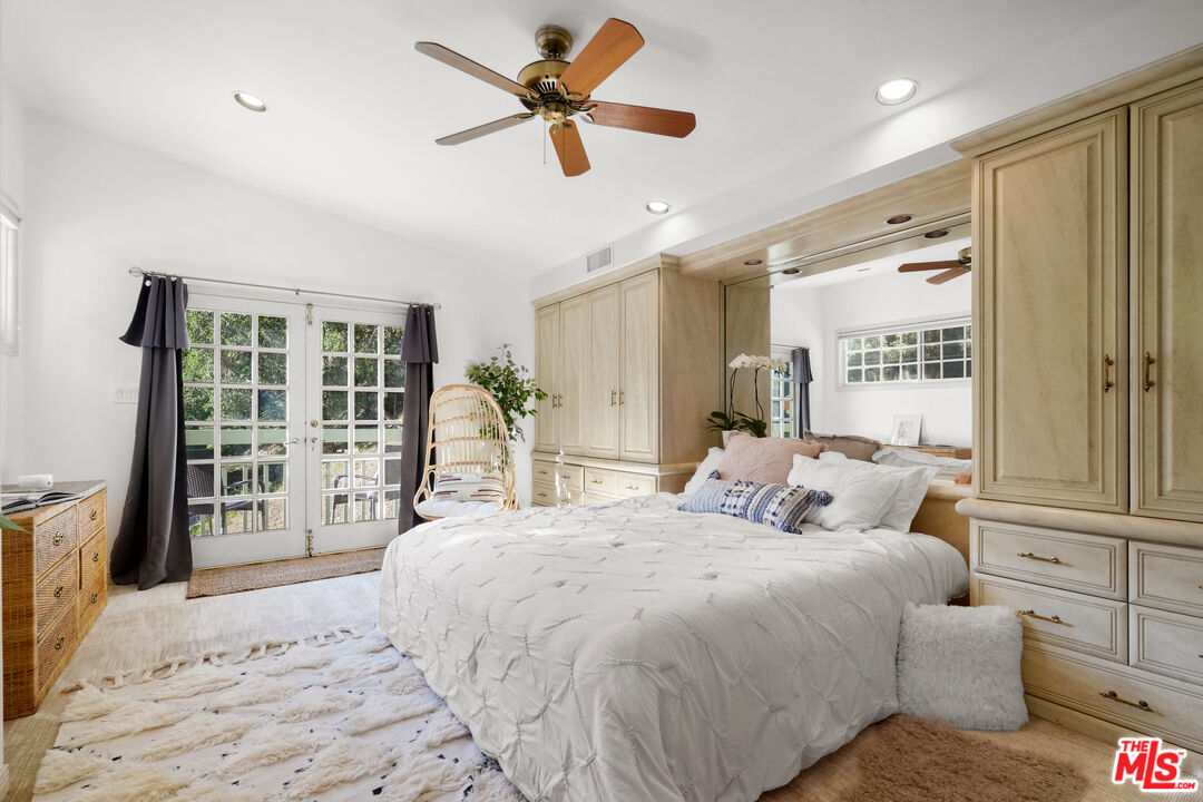 964 Old Topanga Canyon Road Topanga, CA 90290 - Photo 36 of 75 a spacious bedroom with a large bed and a chandelier