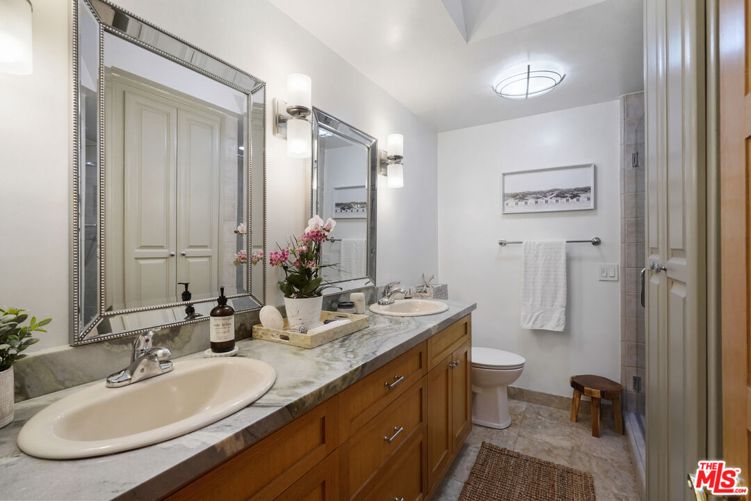 964 Old Topanga Canyon Road Topanga, CA 90290 - Photo 52 of 75 a bathroom with 2 sink and a mirror