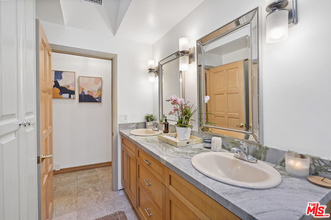 964 Old Topanga Canyon Road Topanga, CA 90290 - Photo 53 of 75 a bathroom with a double vanity sink and a mirror