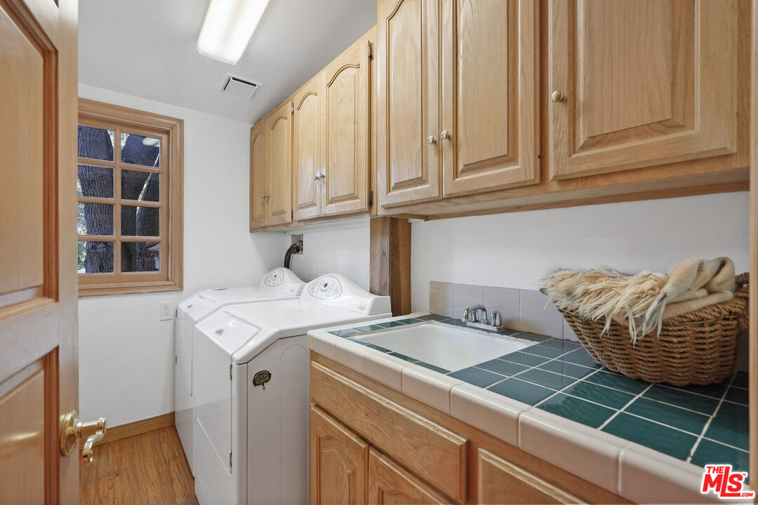 964 Old Topanga Canyon Road Topanga, CA 90290 - Photo 54 of 75 a utility room with dryer and washer