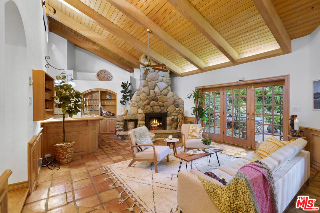 964 Old Topanga Canyon Road Topanga, CA 90290 - Photo 6 of 75 a living room with fireplace furniture and a large window