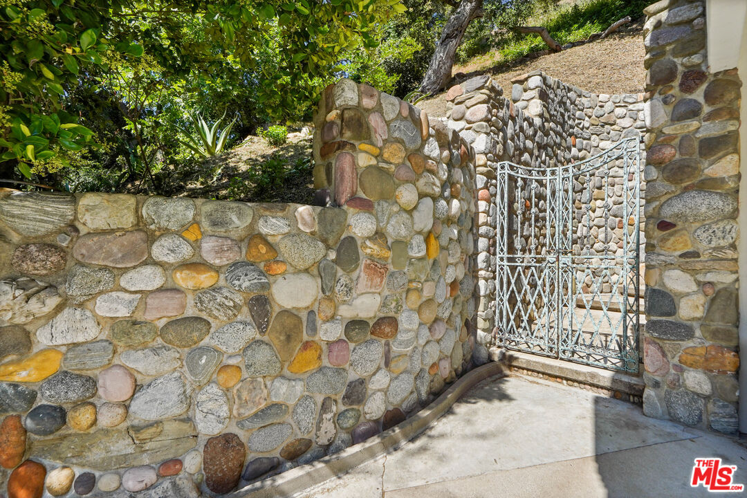964 Old Topanga Canyon Road Topanga, CA 90290 - Photo 73 of 75 a view of a wooden door and bench in front of it