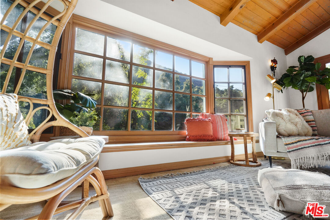 964 Old Topanga Canyon Road Topanga, CA 90290 - Photo 10 of 75 a living room filled with furniture and a floor to ceiling window