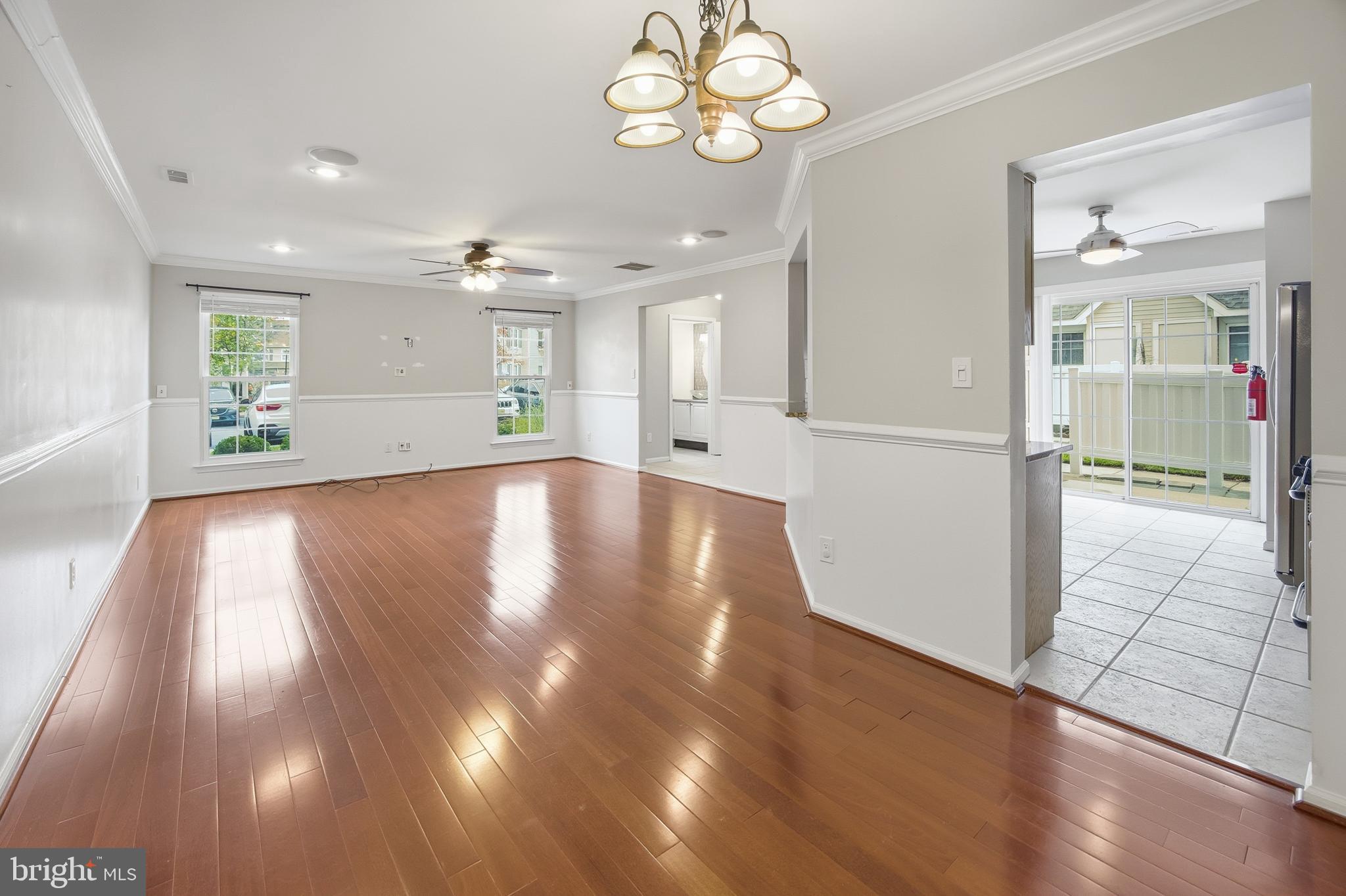 1401 Wharton Road Mount Laurel, NJ 08054 - Photo 11 of 40 a view of an empty room with wooden floor and a kitchen