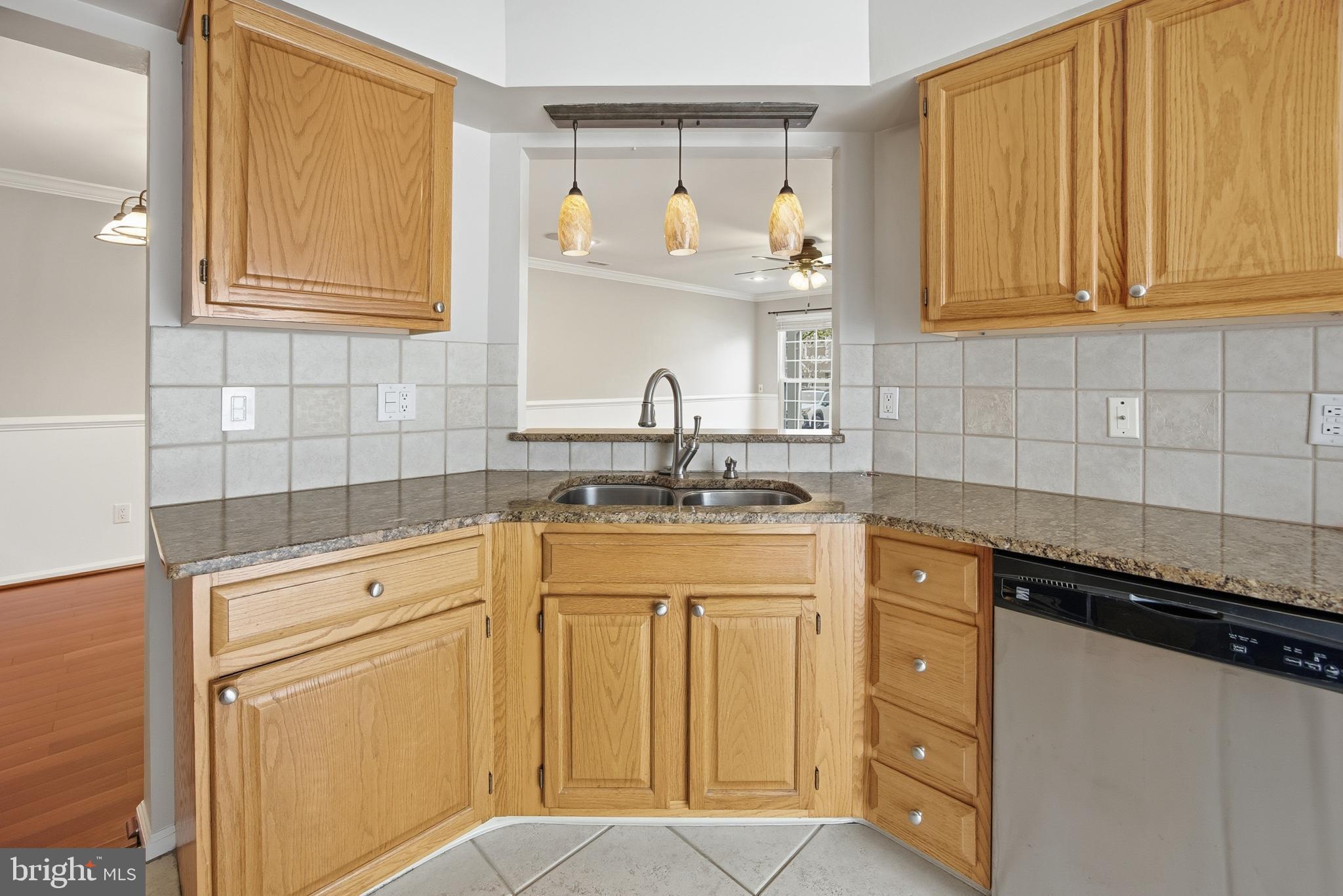 1401 Wharton Road Mount Laurel, NJ 08054 - Photo 14 of 40 a kitchen with granite countertop white cabinets and white appliances