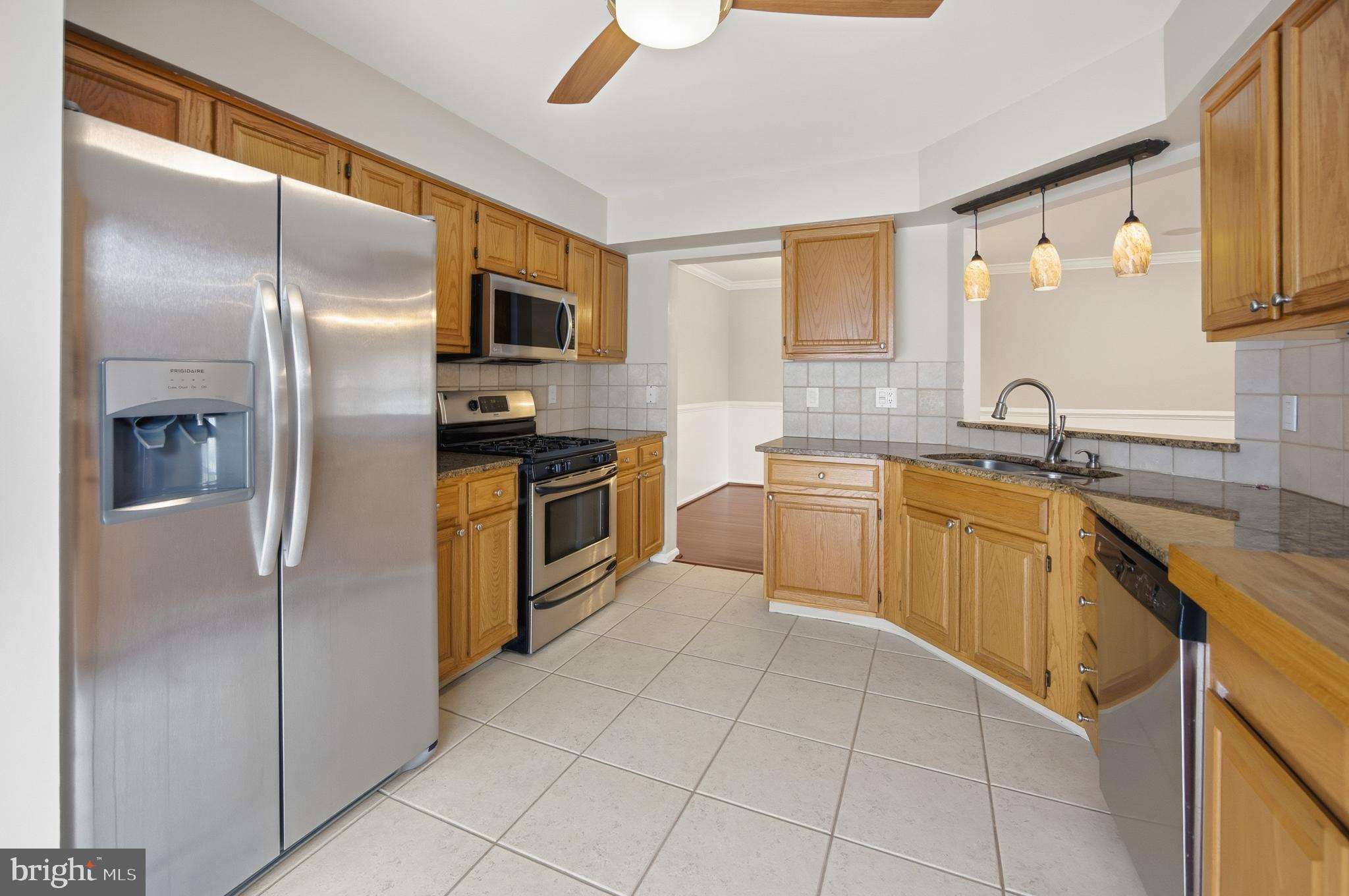 1401 Wharton Road Mount Laurel, NJ 08054 - Photo 17 of 40 a kitchen with stainless steel appliances granite countertop a refrigerator and a sink