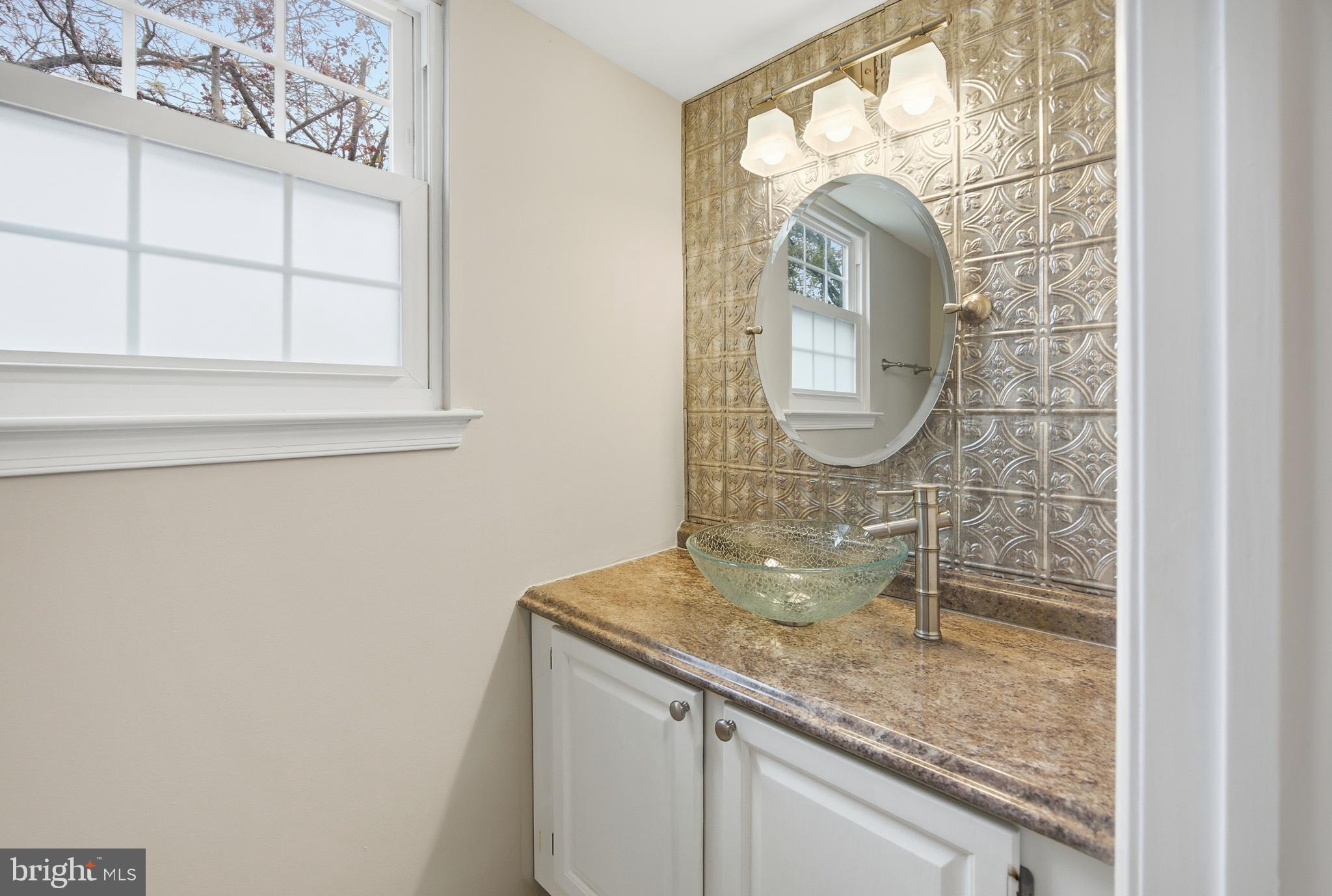 1401 Wharton Road Mount Laurel, NJ 08054 - Photo 18 of 40 a bathroom with a sink and a mirror