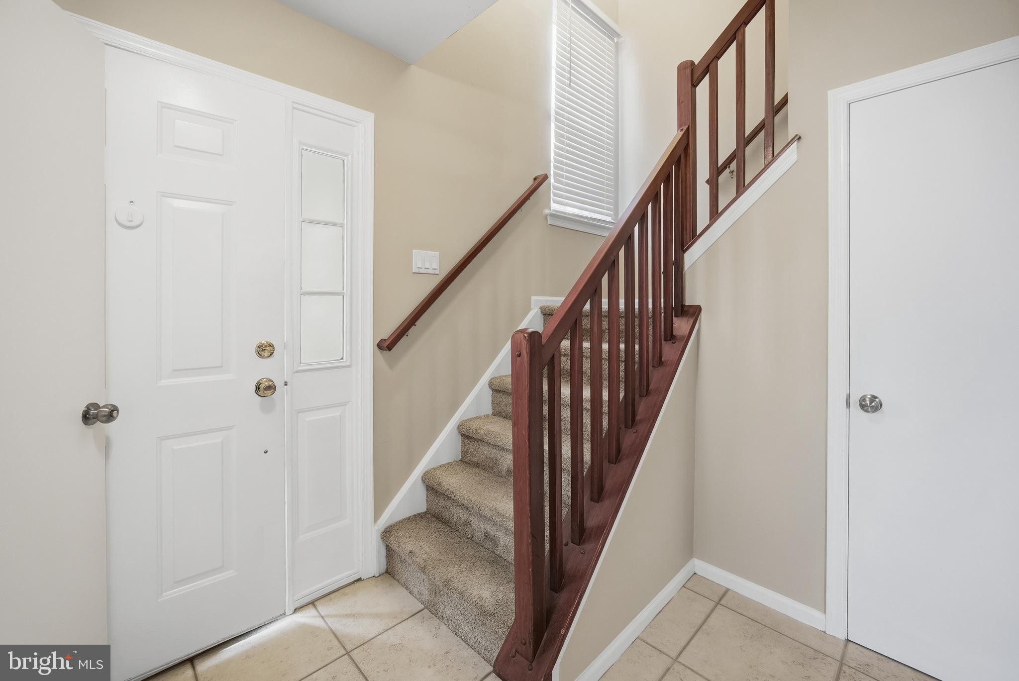 1401 Wharton Road Mount Laurel, NJ 08054 - Photo 19 of 40 a view of staircase with lots of frames on wall and wooden floor