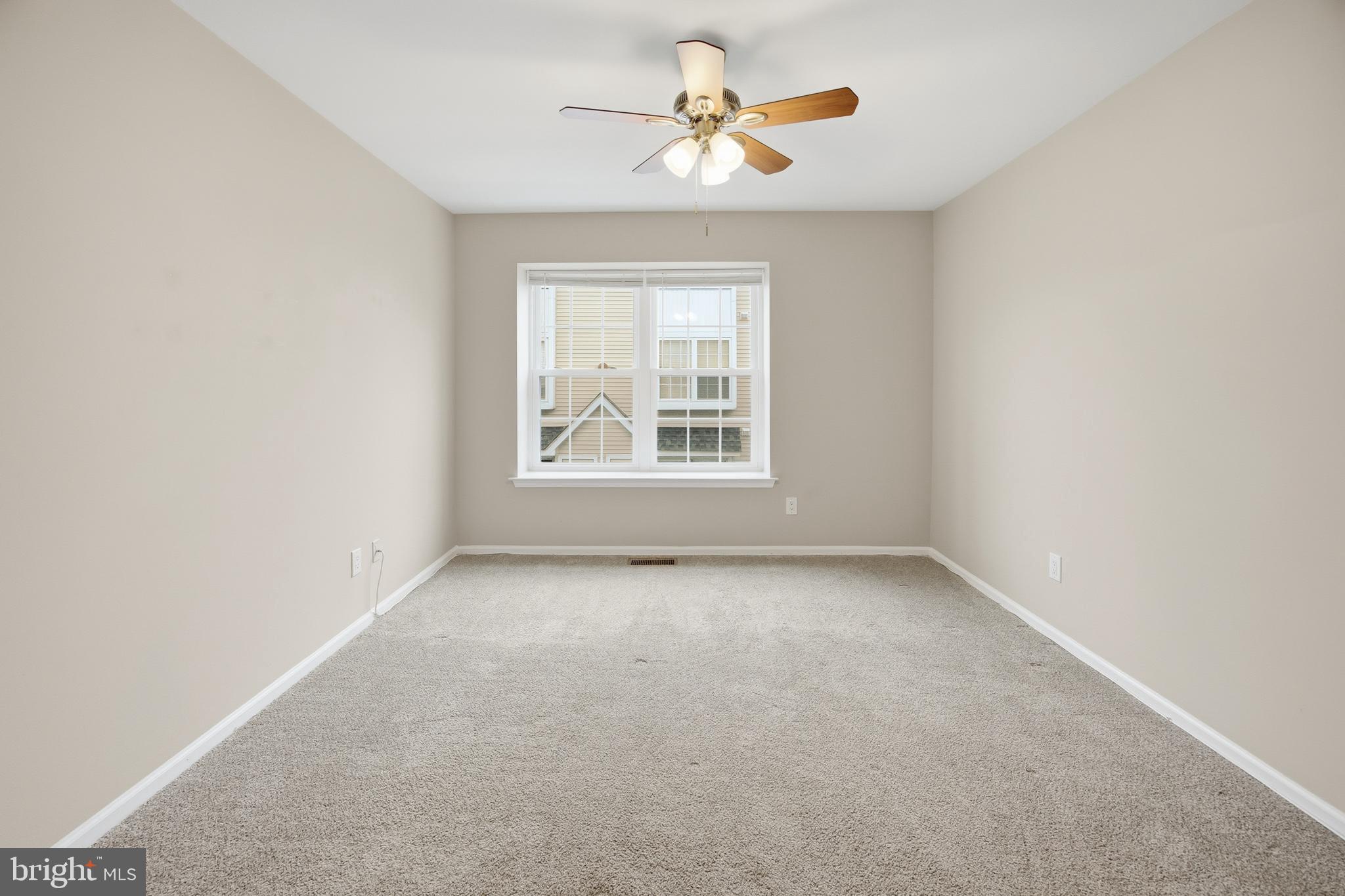 1401 Wharton Road Mount Laurel, NJ 08054 - Photo 20 of 40 an empty room with a window and a ceiling fan