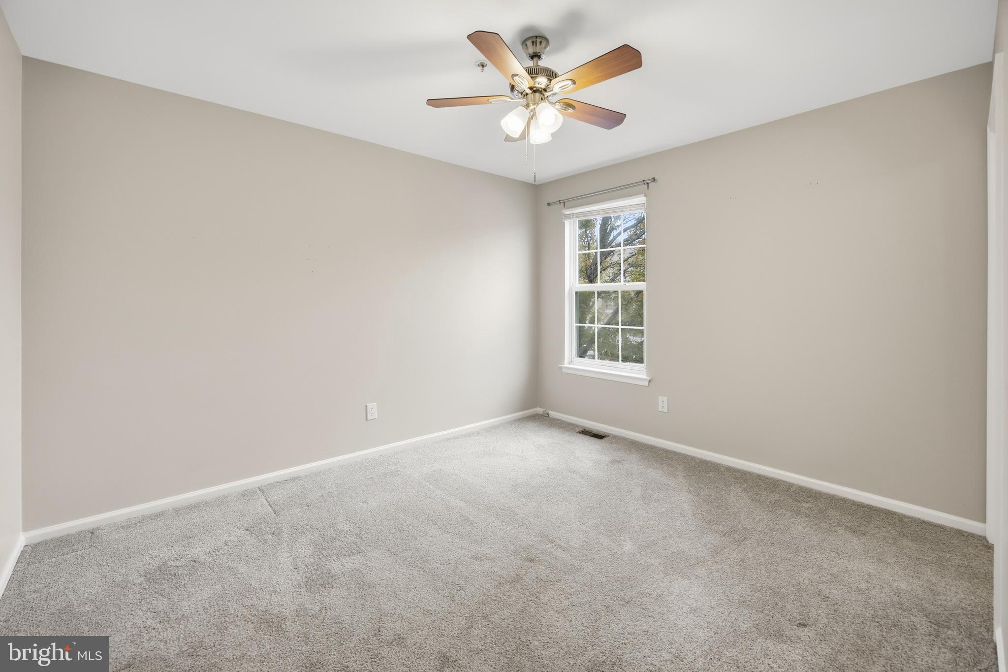 1401 Wharton Road Mount Laurel, NJ 08054 - Photo 21 of 40 an empty room with a window and a fan