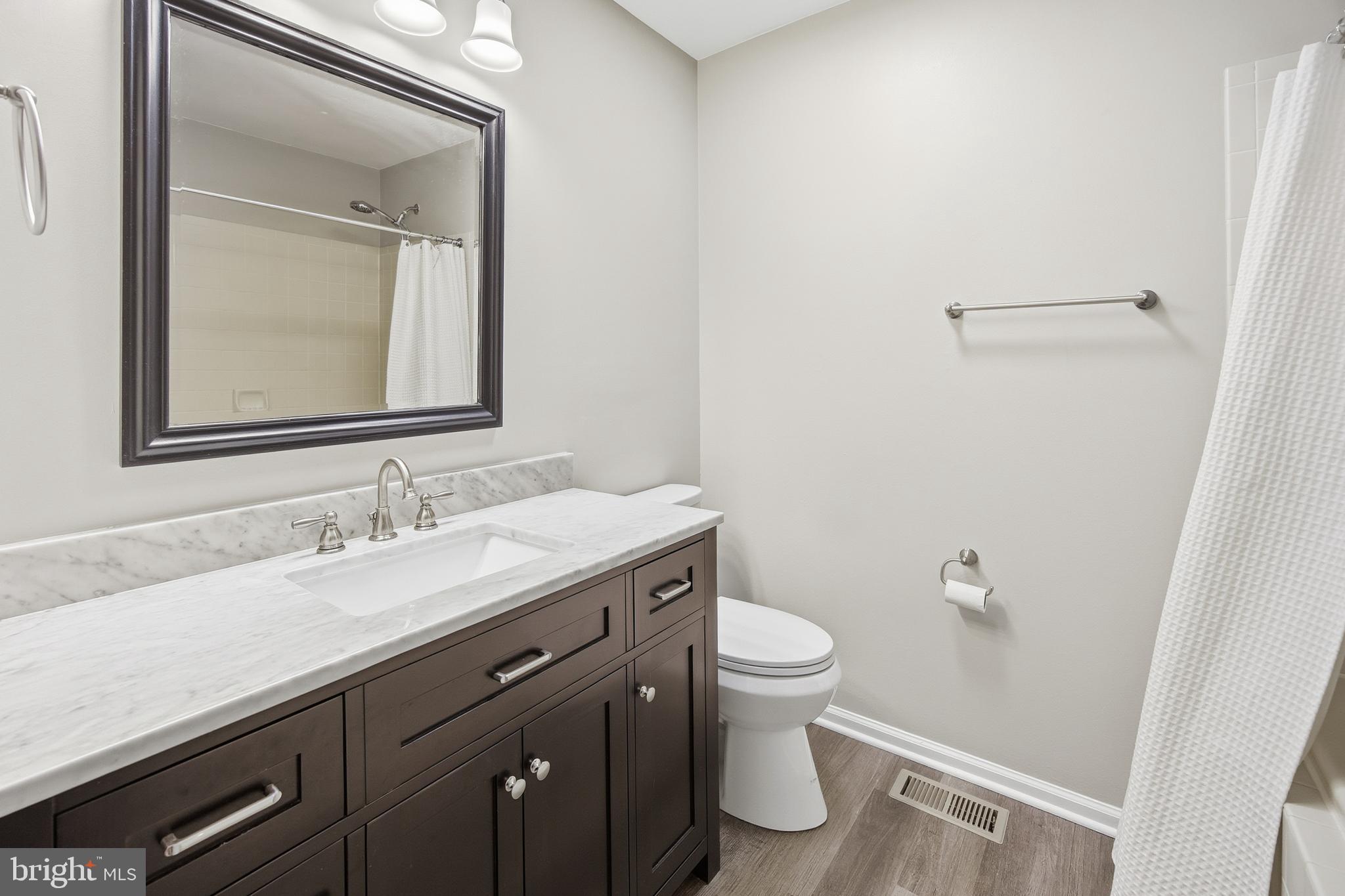 1401 Wharton Road Mount Laurel, NJ 08054 - Photo 28 of 40 a bathroom with a granite countertop sink toilet and mirror