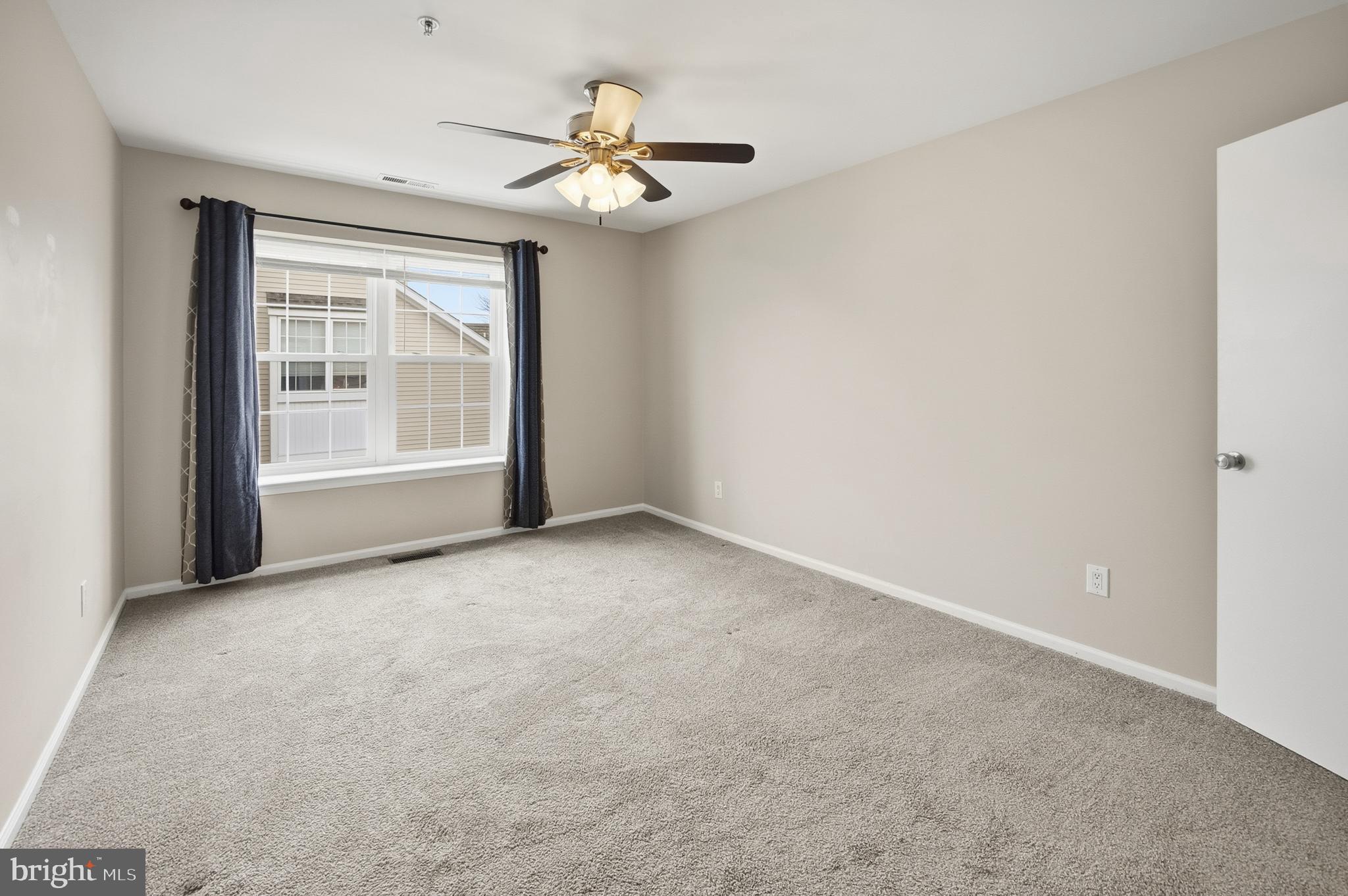 1401 Wharton Road Mount Laurel, NJ 08054 - Photo 33 of 40 an empty room with windows and fan
