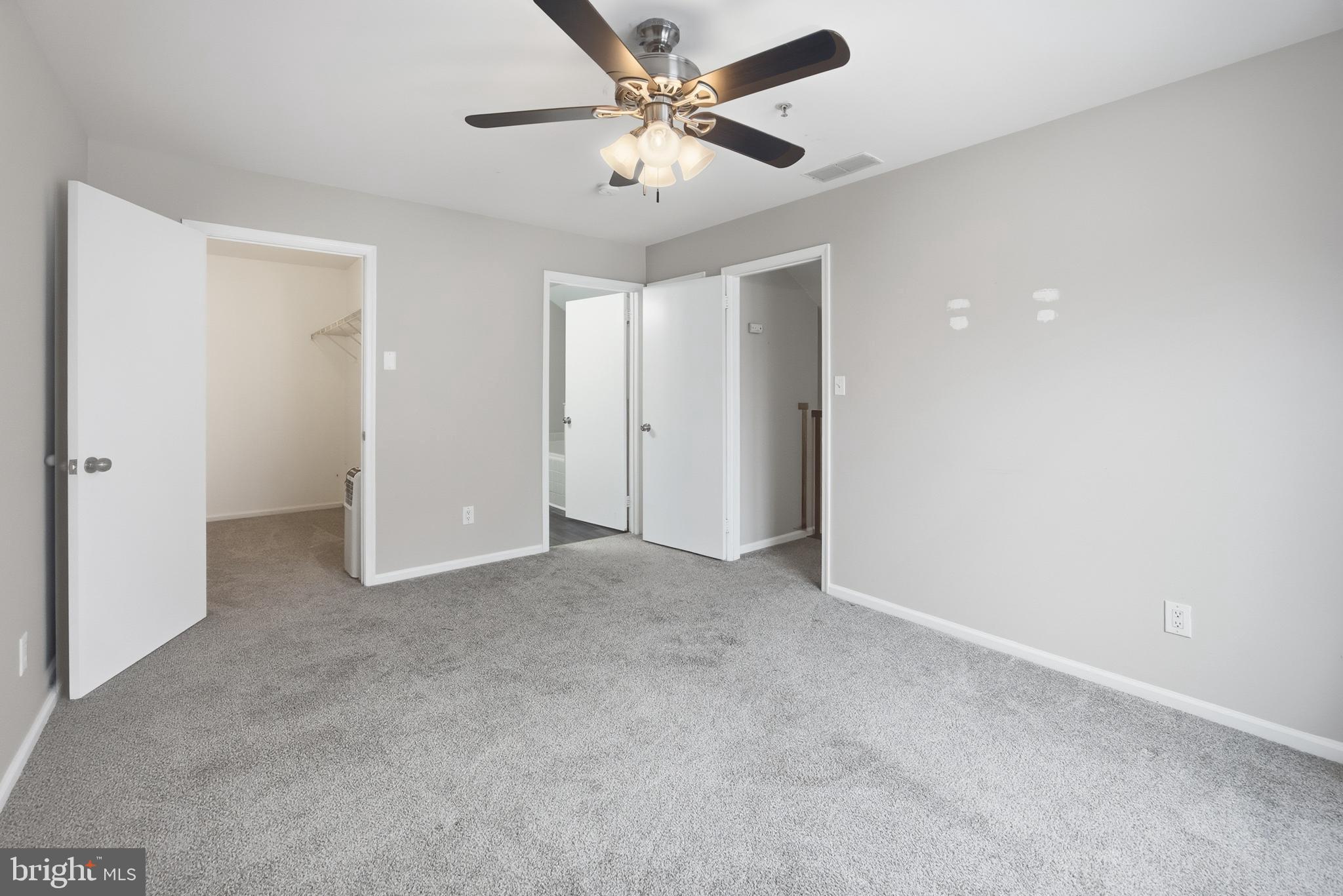 1401 Wharton Road Mount Laurel, NJ 08054 - Photo 34 of 40 an empty room with closet and a ceiling fan
